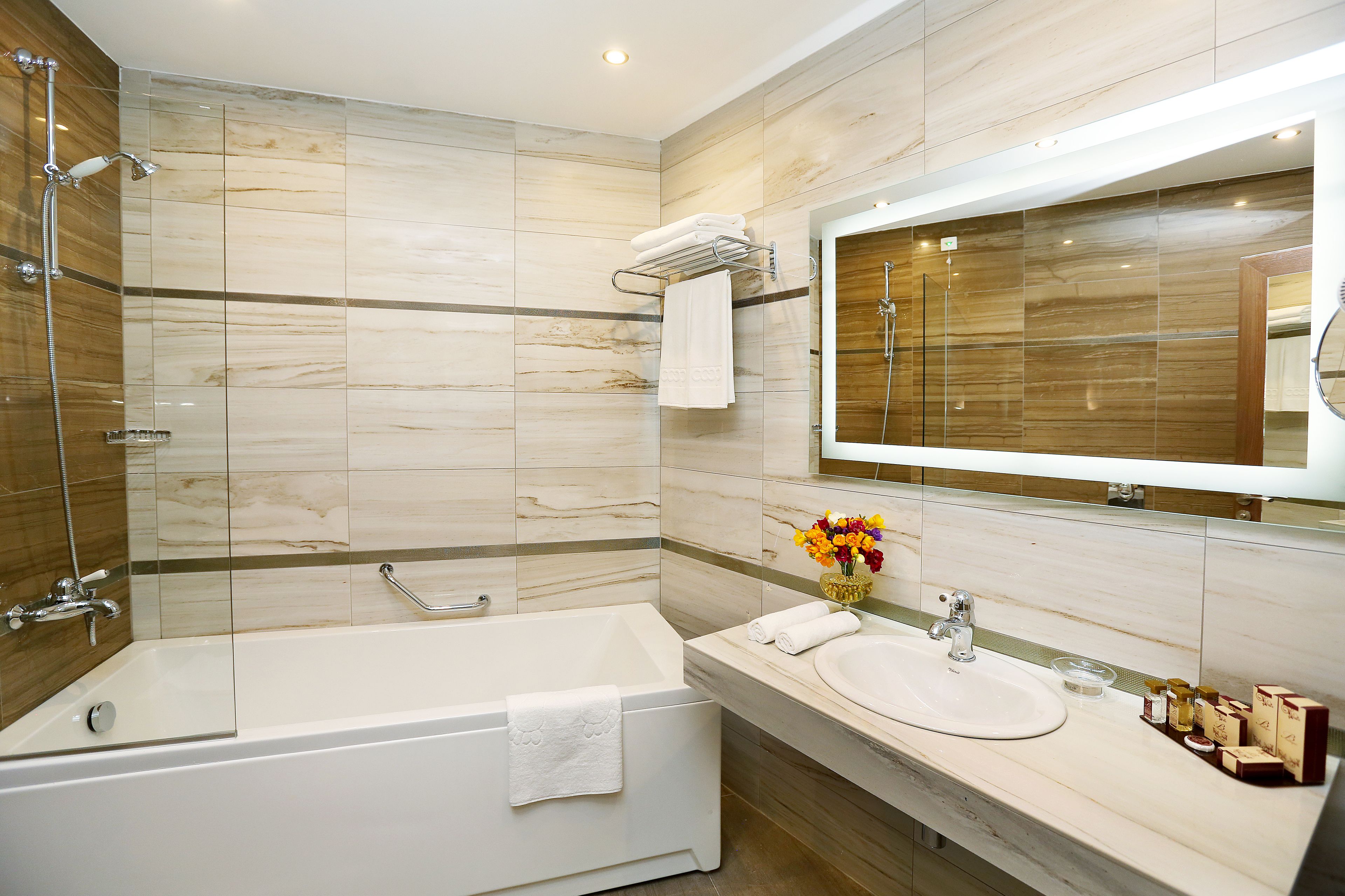 family suite (2 bathrooms) | bathroom | deep-soaking bathtub, designer toiletries, hair dryer, bathrobes