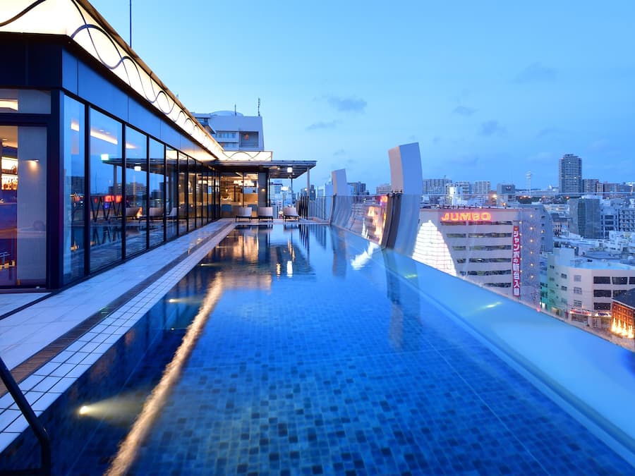 Outdoor pool, open 10:00 AM to 11:00 PM, pool loungers