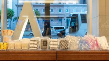 A display of various packaged items in a store window.