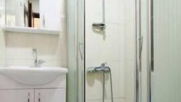 Shower, free toiletries, hair dryer, slippers