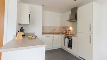Apartment, 2 Bedrooms | Private kitchen | Full-size fridge, microwave, oven, dishwasher