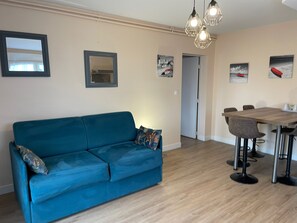 Comfort Apartment, Kitchen, Partial Sea View | Living area | Flat-screen TV