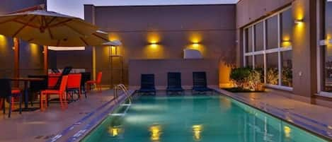 Outdoor pool, open 6:00 AM to 10:00 PM, pool umbrellas, pool loungers