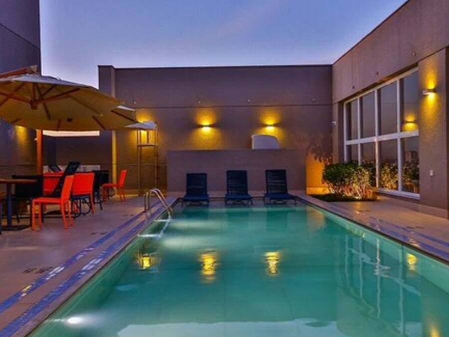 Outdoor pool, open 6:00 AM to 10:00 PM, pool umbrellas, sun loungers