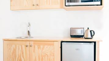 Deluxe Room, Accessible, Ground Floor | Private kitchenette | Fridge, microwave, stovetop, electric kettle