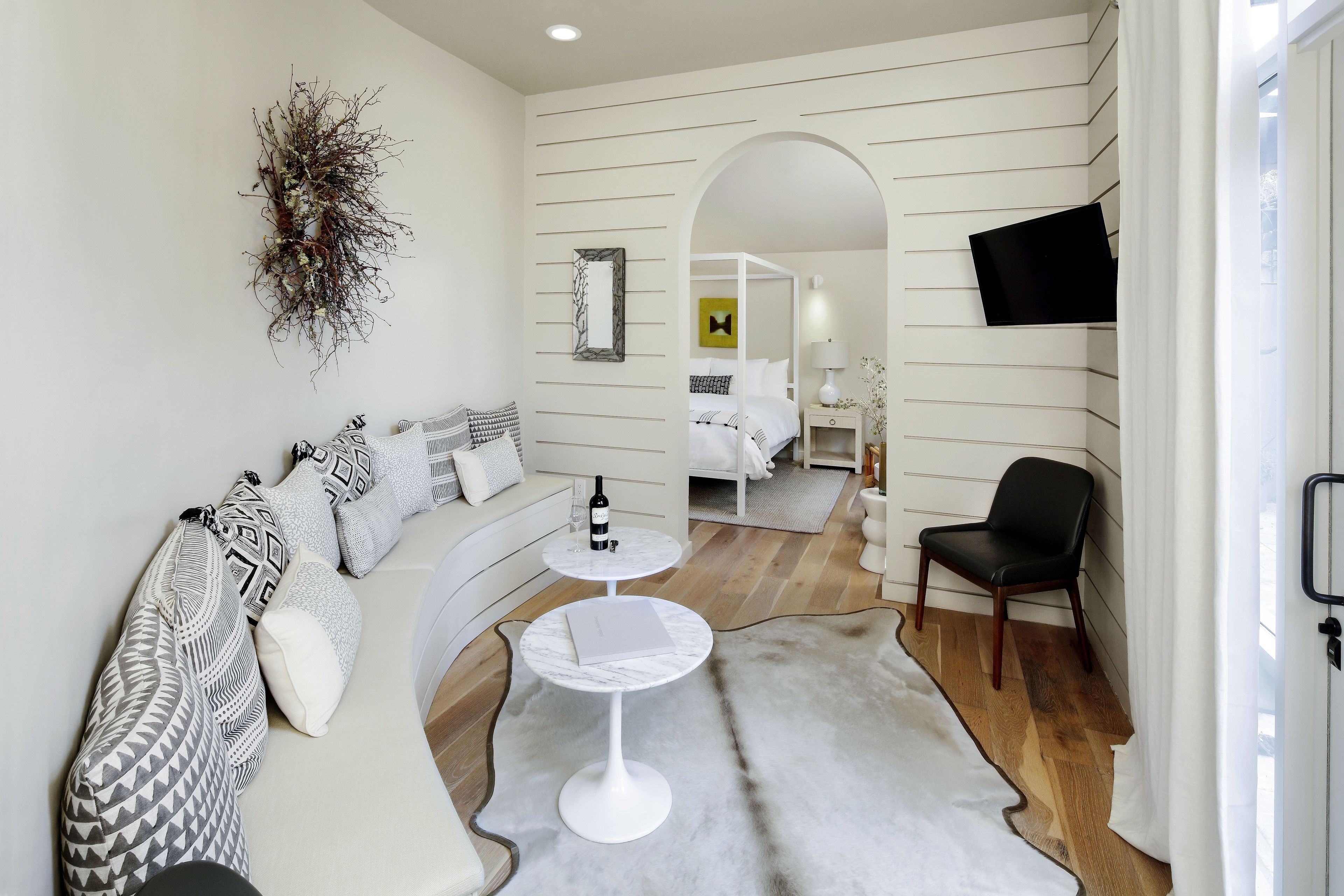 luxury studio, 1 king bed, kitchenette, ground floor | living area | 46-inch flat-screen tv with satellite channels, fireplace, heated floors