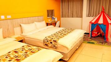 Standard Quadruple Room, City View | Desk, blackout drapes, iron/ironing board, free WiFi