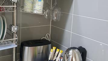 Family Apartment, Multiple Beds | Private kitchenette | Fridge, microwave, stovetop, coffee/tea maker