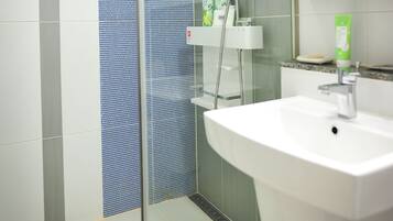 Shower, free toiletries, hair dryer, slippers