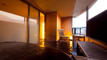 Executive Room, Hot Tub | Bathroom | Hair dryer, slippers, towels, soap