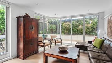 1 Bedroom, 1 Bathroom Apartment | Living area | Flat-screen TV, DVD player