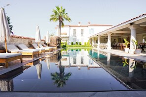 Outdoor pool, pool umbrellas, pool loungers