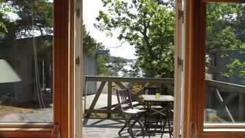 Cabane, terrasse, vue partielle sur l'océan | Terrasse/Patio