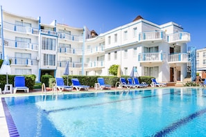 Outdoor pool, pool umbrellas, pool loungers