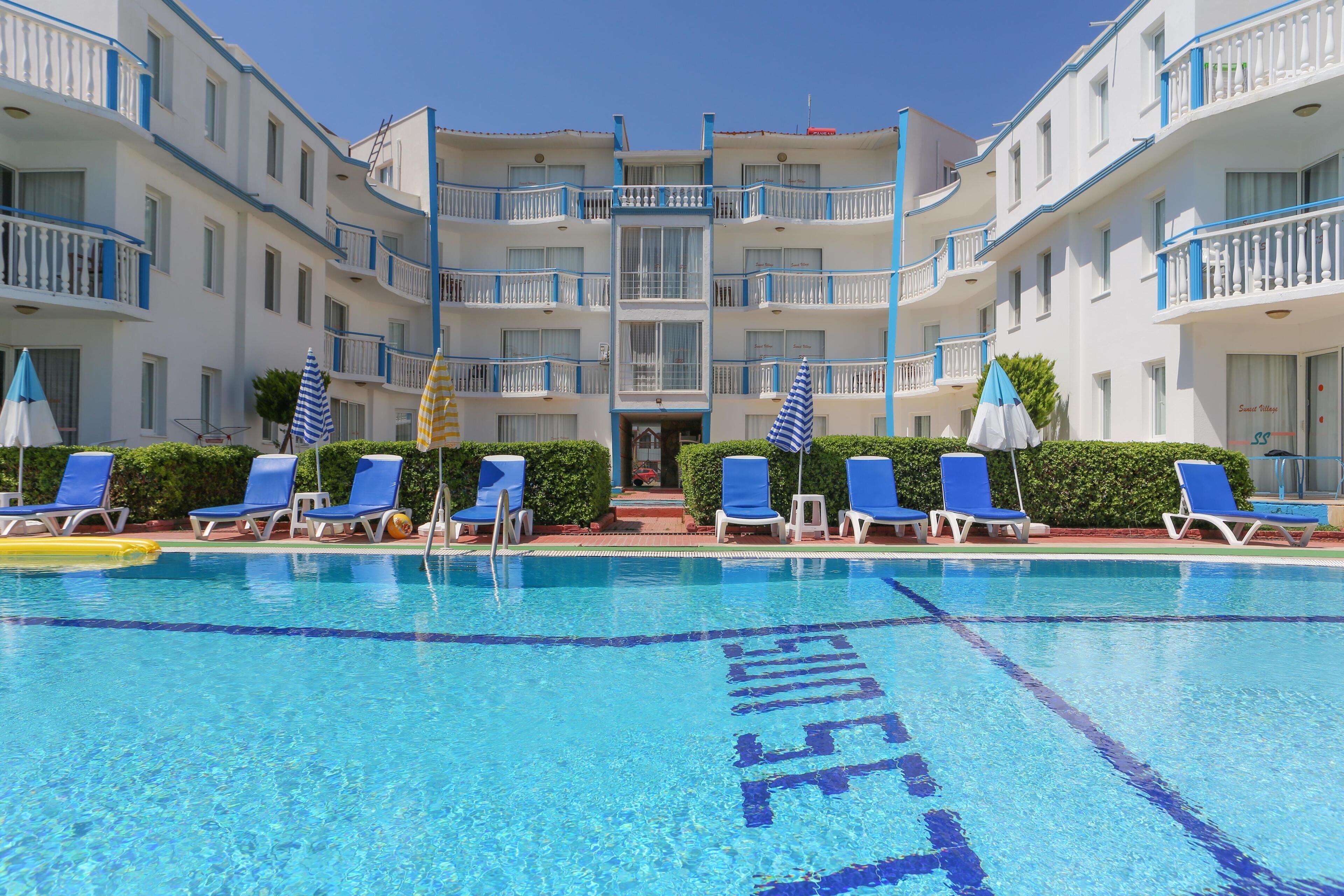 Outdoor pool, pool umbrellas, sun loungers