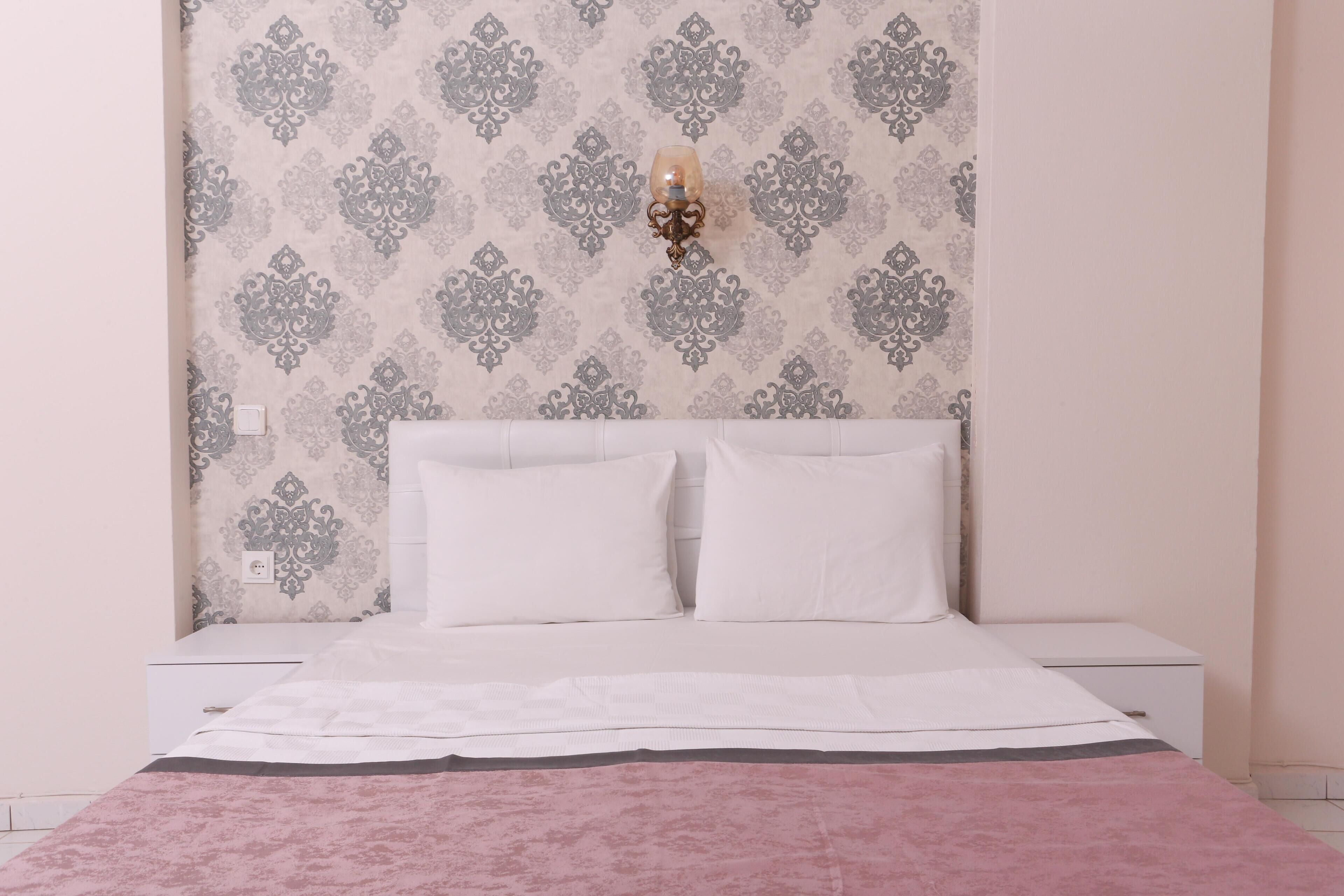 Apartamento standard, 2 quartos | 2 quartos, roupas de cama premium, frigobar, escrivaninha