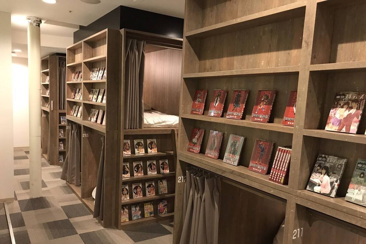 A library with wooden bookshelves and a checkered floor.