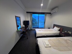 经济双床房, 2 张单人床 (Bed) | 办公桌、遮光窗帘、免费 WiFi、床单