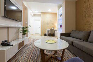 Family Room, 1 Queen Bed with Sofa bed, Non Smoking, Balcony | Living area | 42-inch flat-screen TV with cable channels, TV