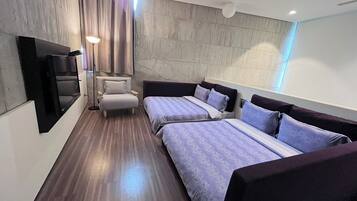 Deluxe Quadruple Room, Terrace, Mezzanine | Down duvets, minibar, individually decorated, soundproofing