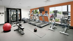 A gym with treadmills, exercise balls, and weight machines. - Hampton Inn Denver Tech Center South CO (Englewood)
