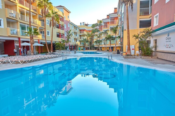 2 outdoor pools, pool loungers, lifeguards on site