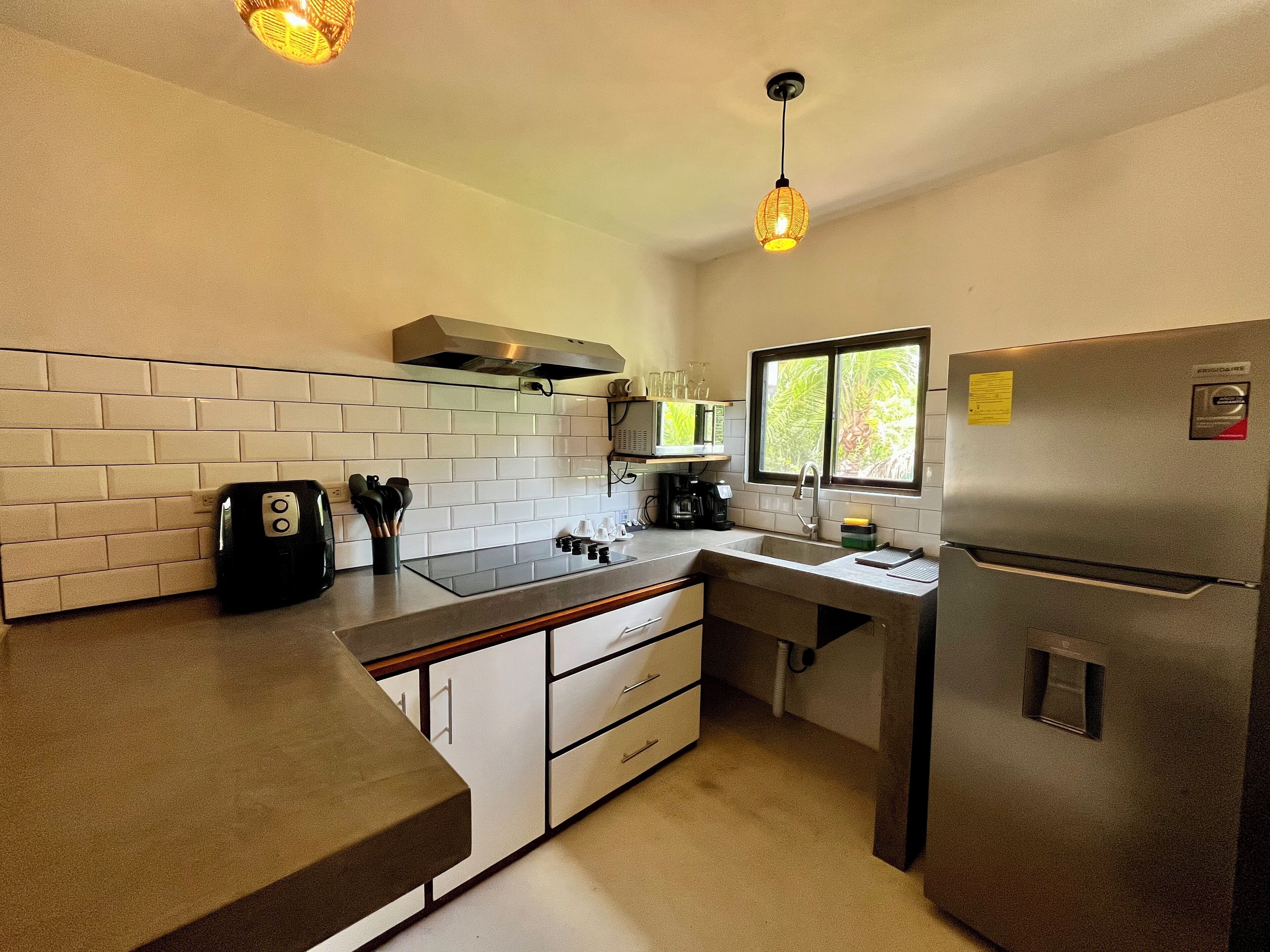 deluxe villa | private kitchen | full-sized fridge, coffee/tea maker