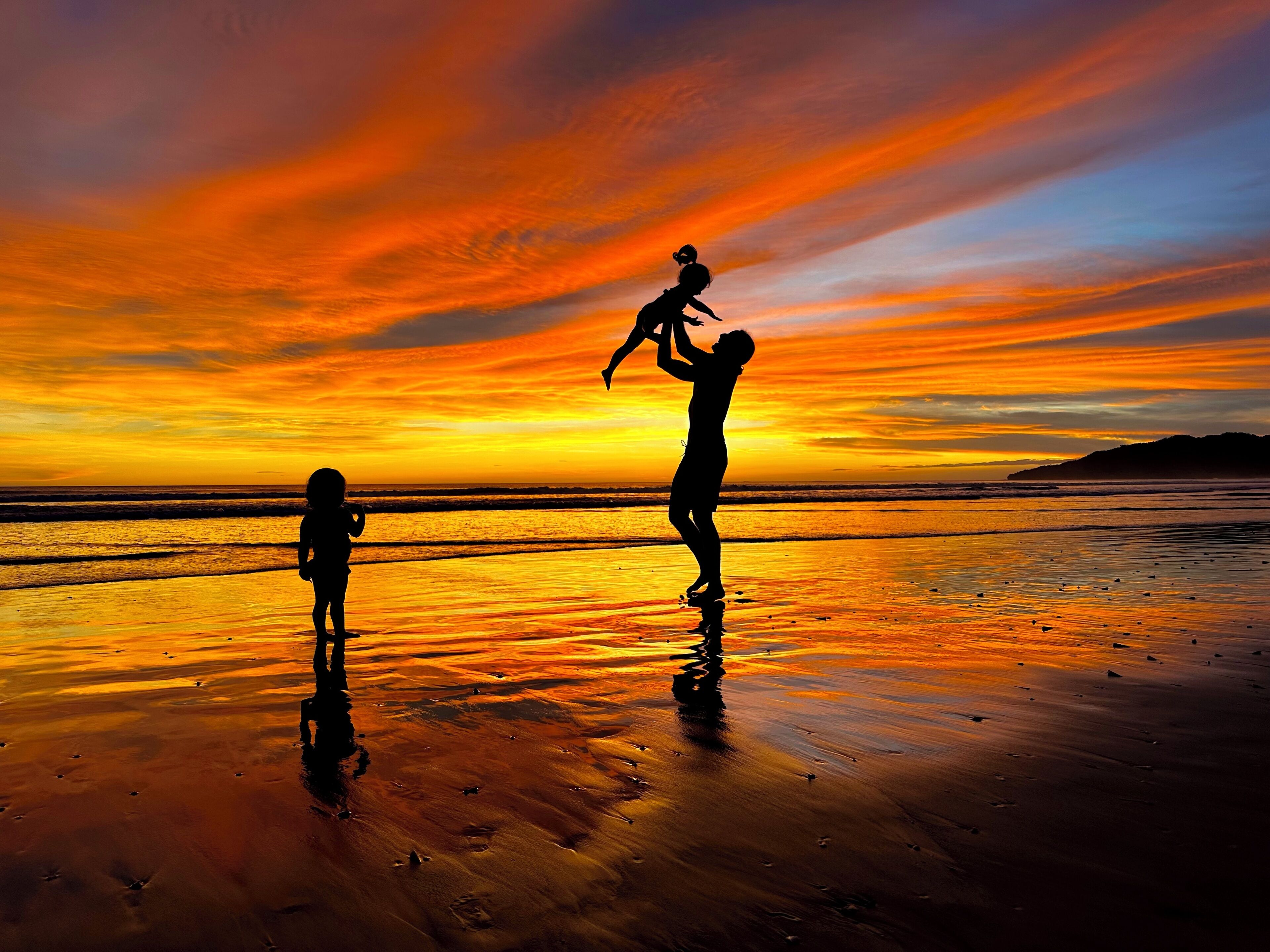 A beach scene with a sunset.