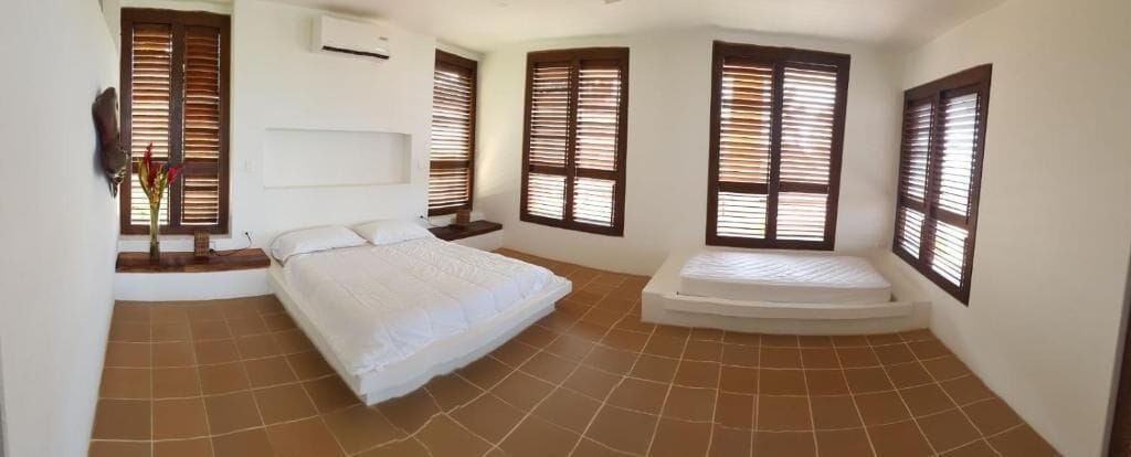 Deluxe Double Room, Partial Ocean View, Poolside | Minibar, in-room safe, bed sheets