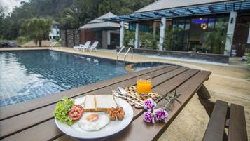 Outdoor pool, pool umbrellas, sun loungers