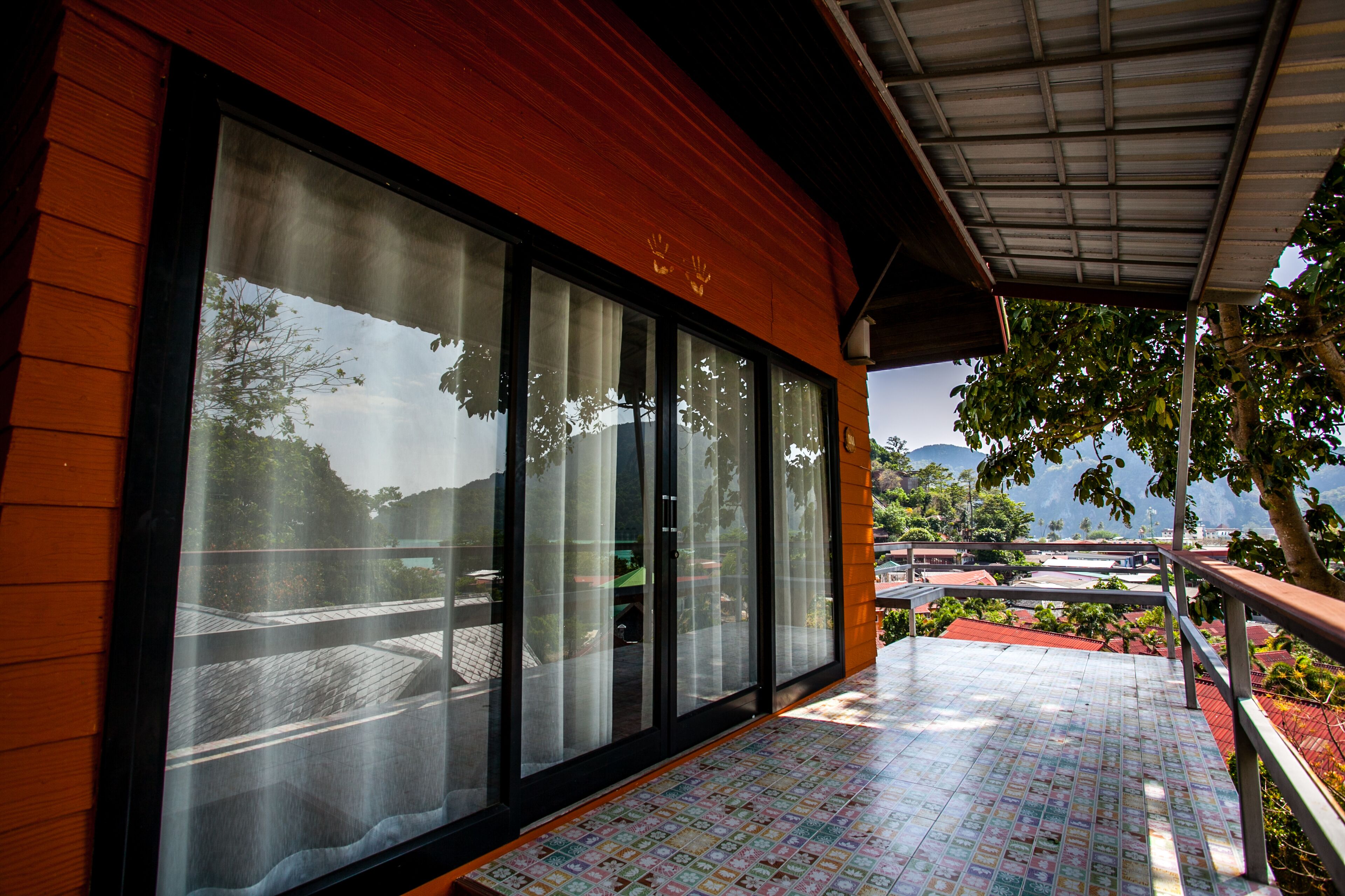 A building with large glass windows and a tiled floor.