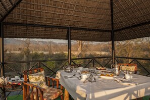 Breakfast, lunch, dinner served; Indian cuisine, pool views 