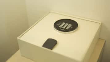 A white box with a black circular device labeled "TATEX" on top.