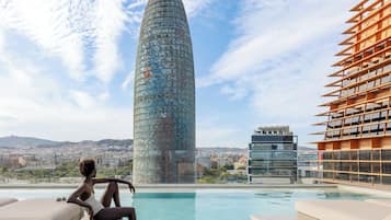 Seasonal outdoor pool, open 9:00 AM to 7:00 PM, pool loungers