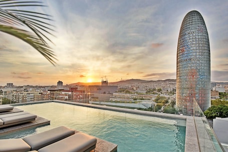 Seasonal outdoor pool, open 9:00 AM to 7:00 PM, sun loungers