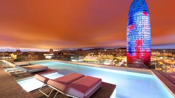 Seasonal outdoor pool, open 9:00 AM to 7:00 PM, sun loungers