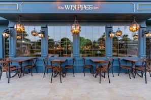 The Whippet Inn exterior with outdoor seating and large windows. - Dosinia Luxury Resort  (Kemer)