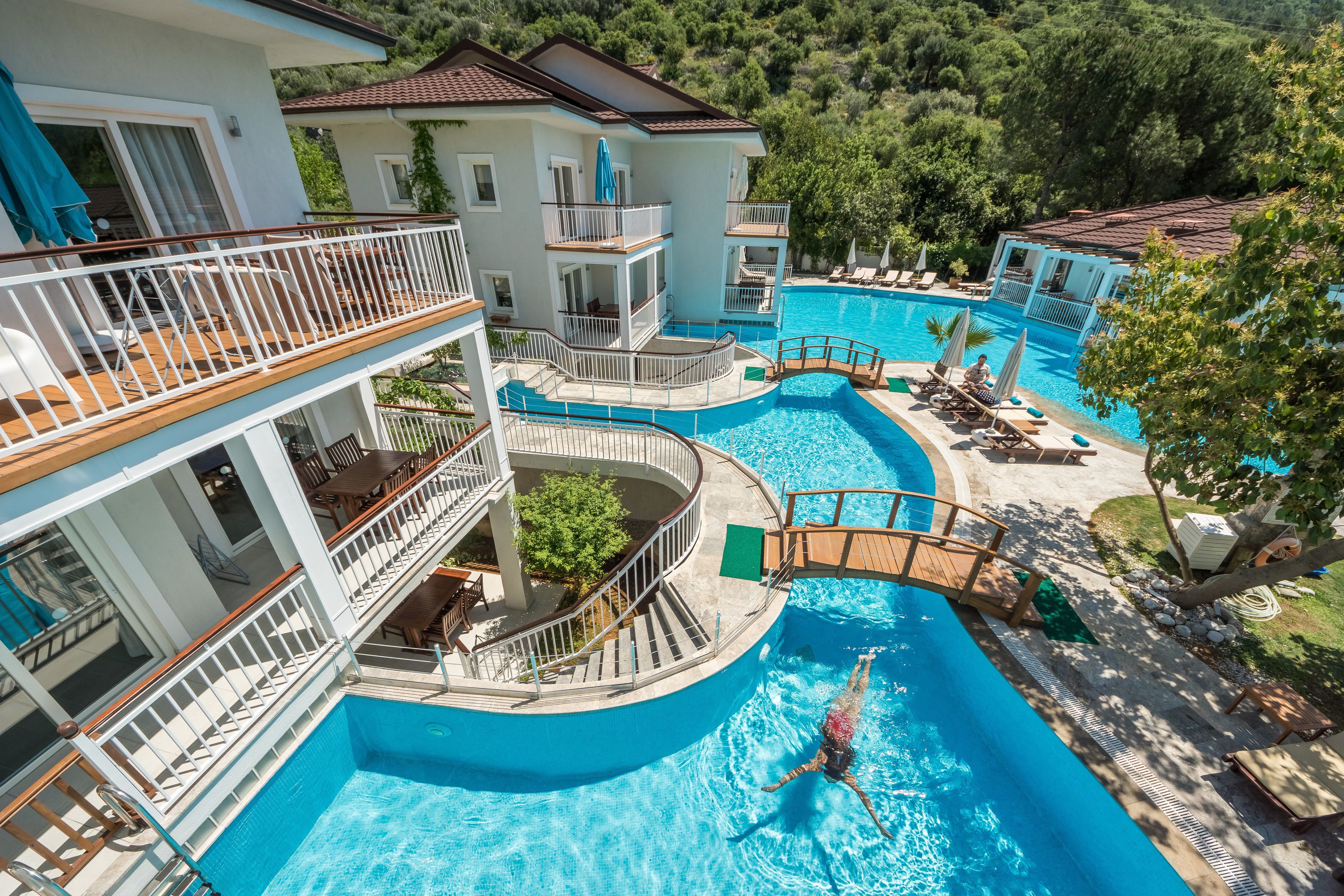 seasonal outdoor pool, open 8:00 am to 8:00 pm, pool umbrellas