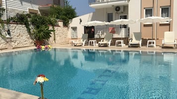 Outdoor pool, pool umbrellas, sun loungers