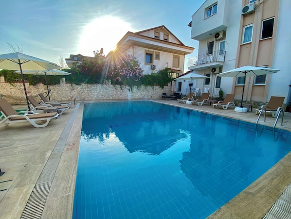 Outdoor pool, pool umbrellas, pool loungers