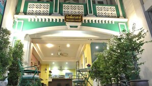 The entrance to a building with a sign reading "MACHIMA HOUSE". - Machima House (Phuket)