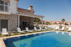 Outdoor pool, pool umbrellas, pool loungers