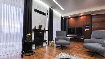 55-inch flat-screen TV with cable channels, LCD TV, fireplace