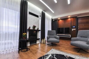 55-inch flat-screen TV with cable channels, LCD TV, fireplace