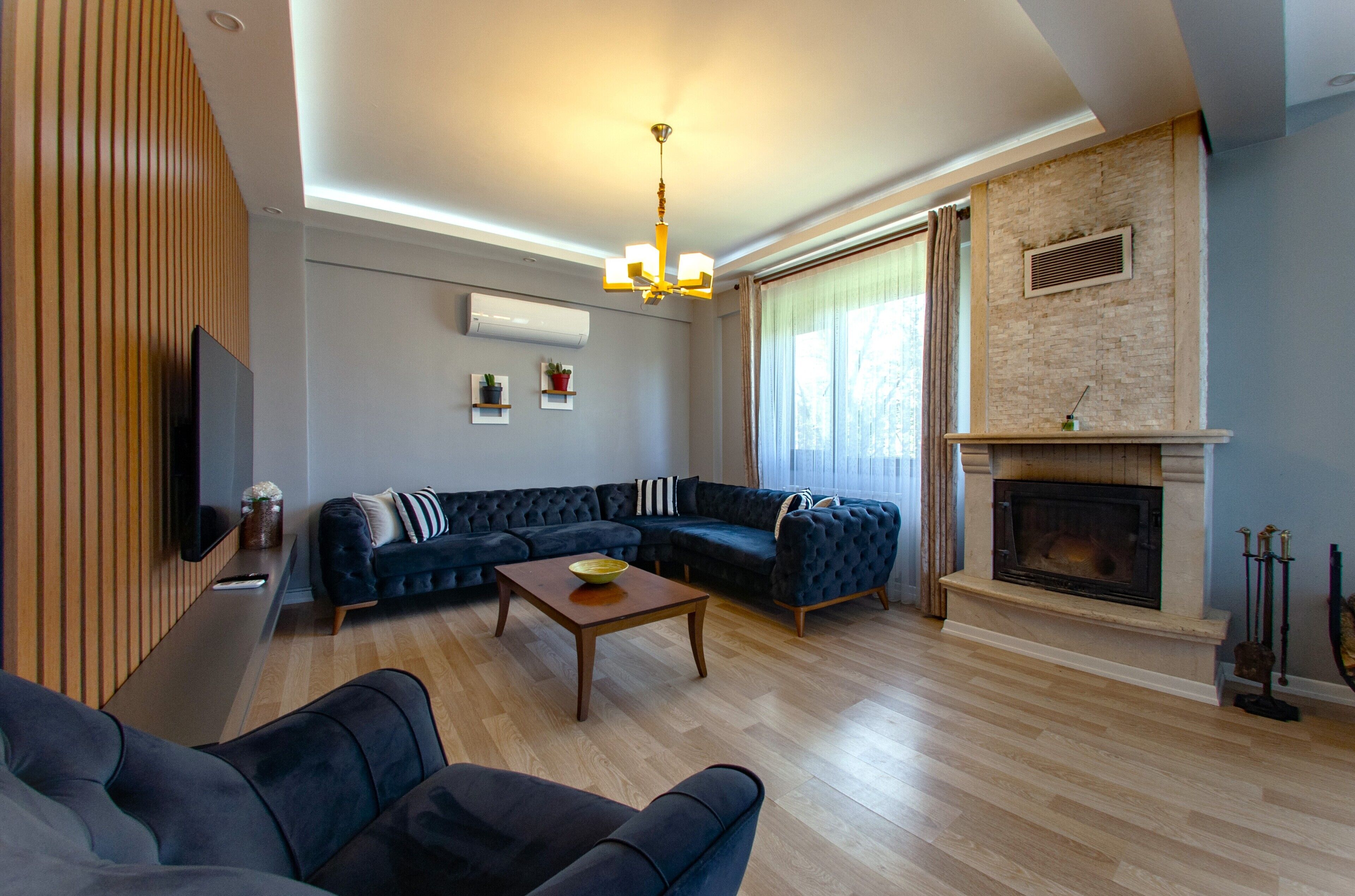 Deluxe Villa | Living area | 55-inch flat-screen TV with cable channels, LCD TV, fireplace