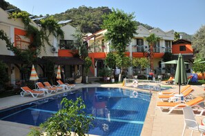 Comfort Quadruple Room, Pool View, Poolside | Premium bedding, minibar, desk, laptop workspace - Tokgoz Butik Hotel & Apartments (Fethiye)