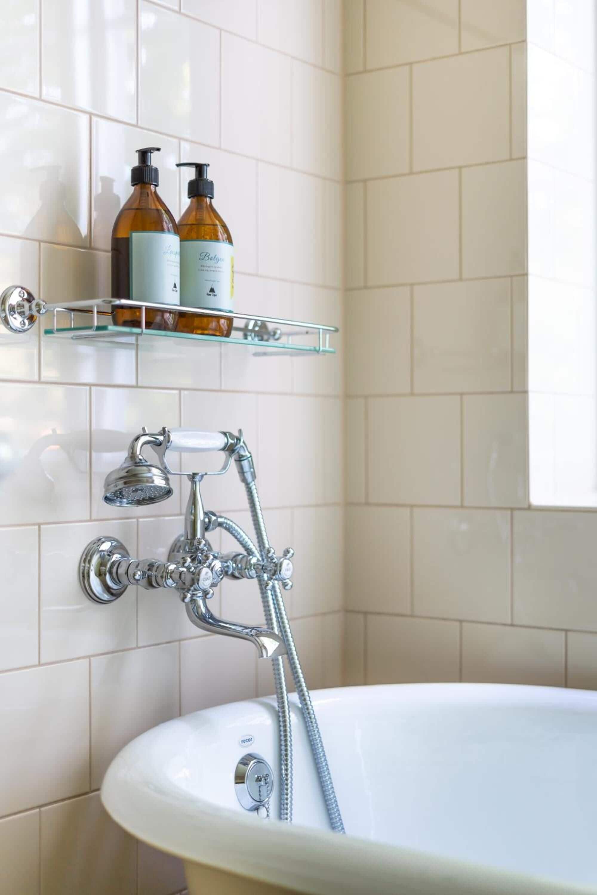 deep-soaking bathtub, hair dryer, towels, soap