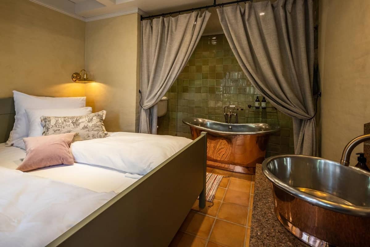 Bathroom | Deep-soaking bathtub, hair dryer, towels, soap