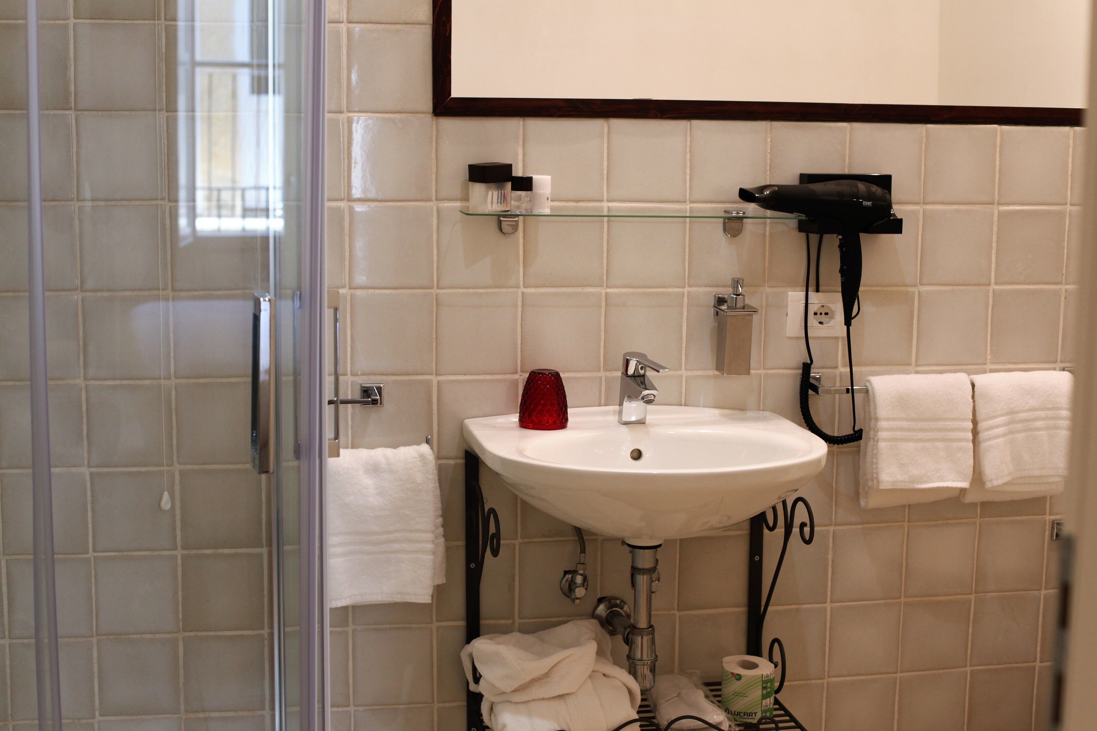 Studio | Bathroom | Rainfall showerhead, designer toiletries, hair dryer, slippers
