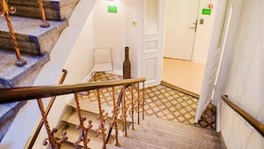 A staircase with ornate metal railings and a patterned floor. - H5 Hotel (Helsingborg)